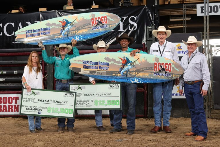 Kaleb Driggers and Junior Nogueira posing with their surfboards after winning the 2021 WCRA Rodeo Corpus Christi.