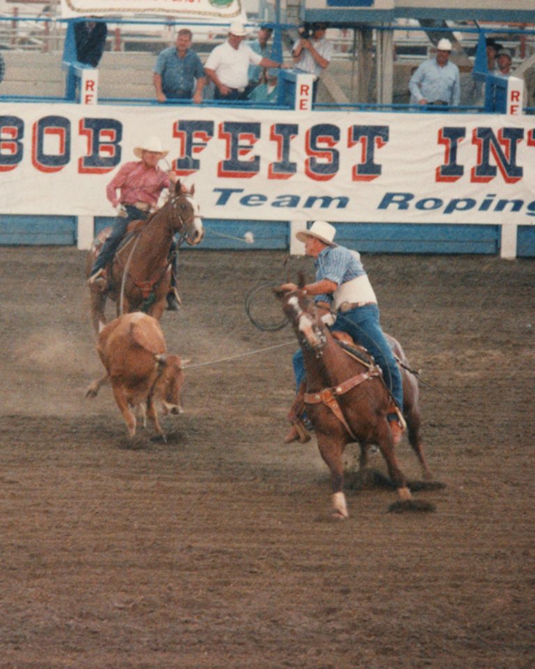 Jake Barnes and Clay O'Brien Cooper team roping at the 1988 BFI with Jake riding his horse Big John.